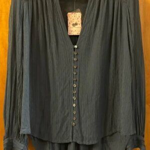 Free People Canyon Rose Top size xs but roomy and could accommodate a small